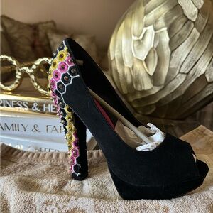 Black suede peep toe pumps